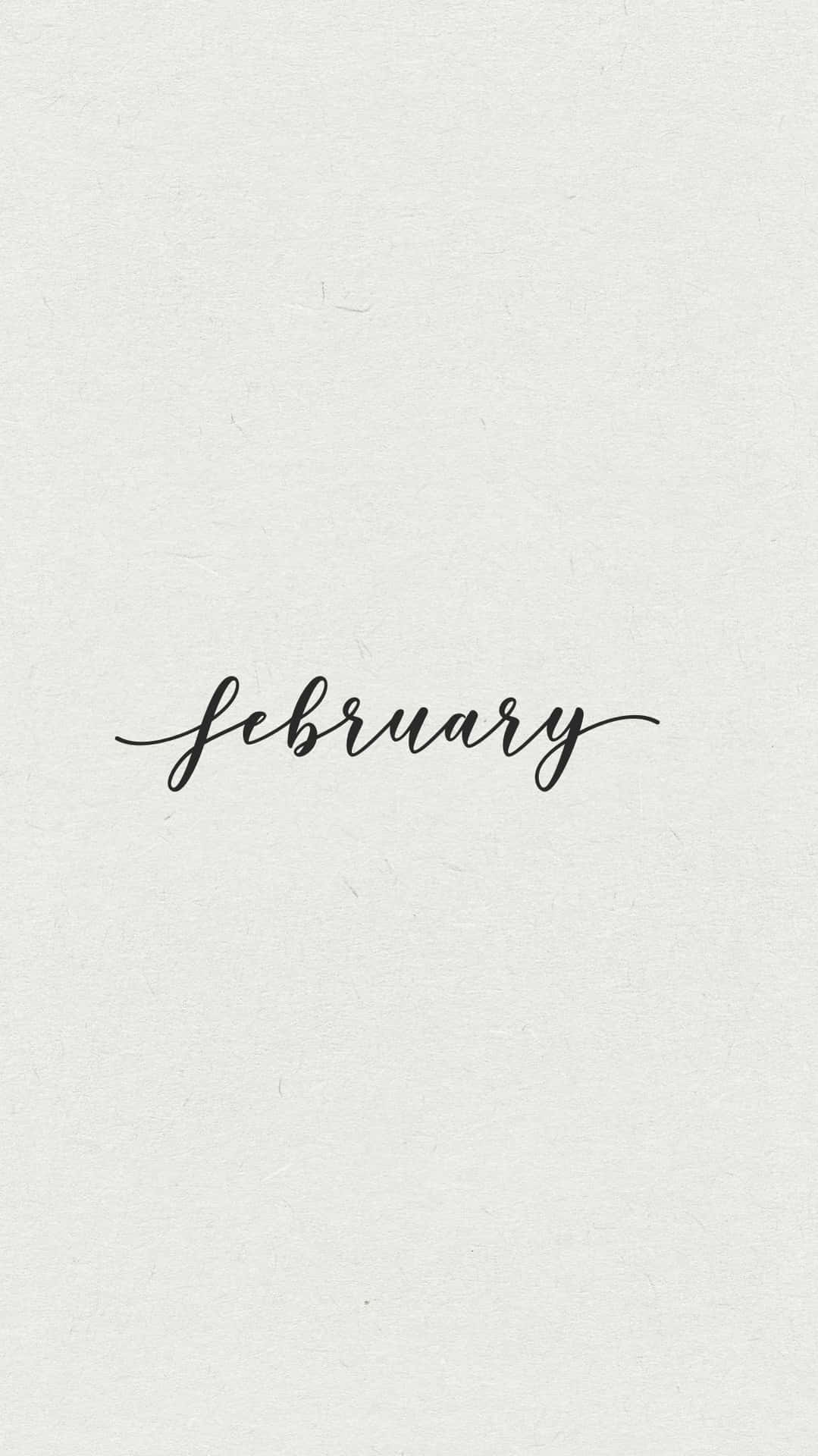February 以優雅黑色草書寫在帶紋理的米白色背景上 — 二月 GIF 壁紙