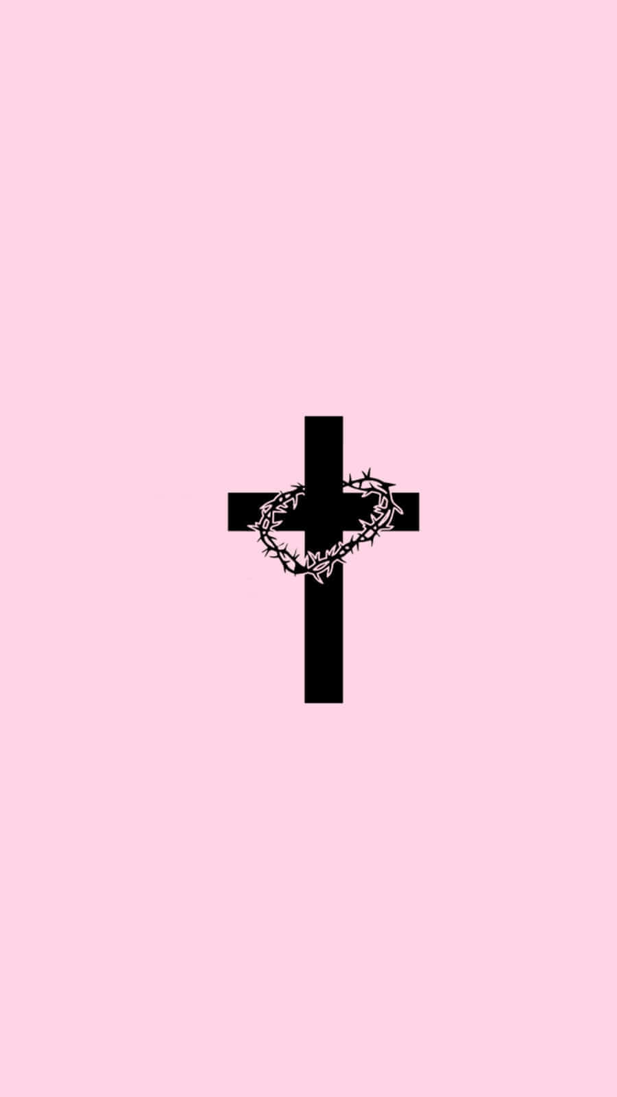 Christian Girl Aesthetic 桌布 壁紙 — 一個鮮明的黑色十字架，帶有荊棘冠冕，置於柔和的粉紅色背景中央。