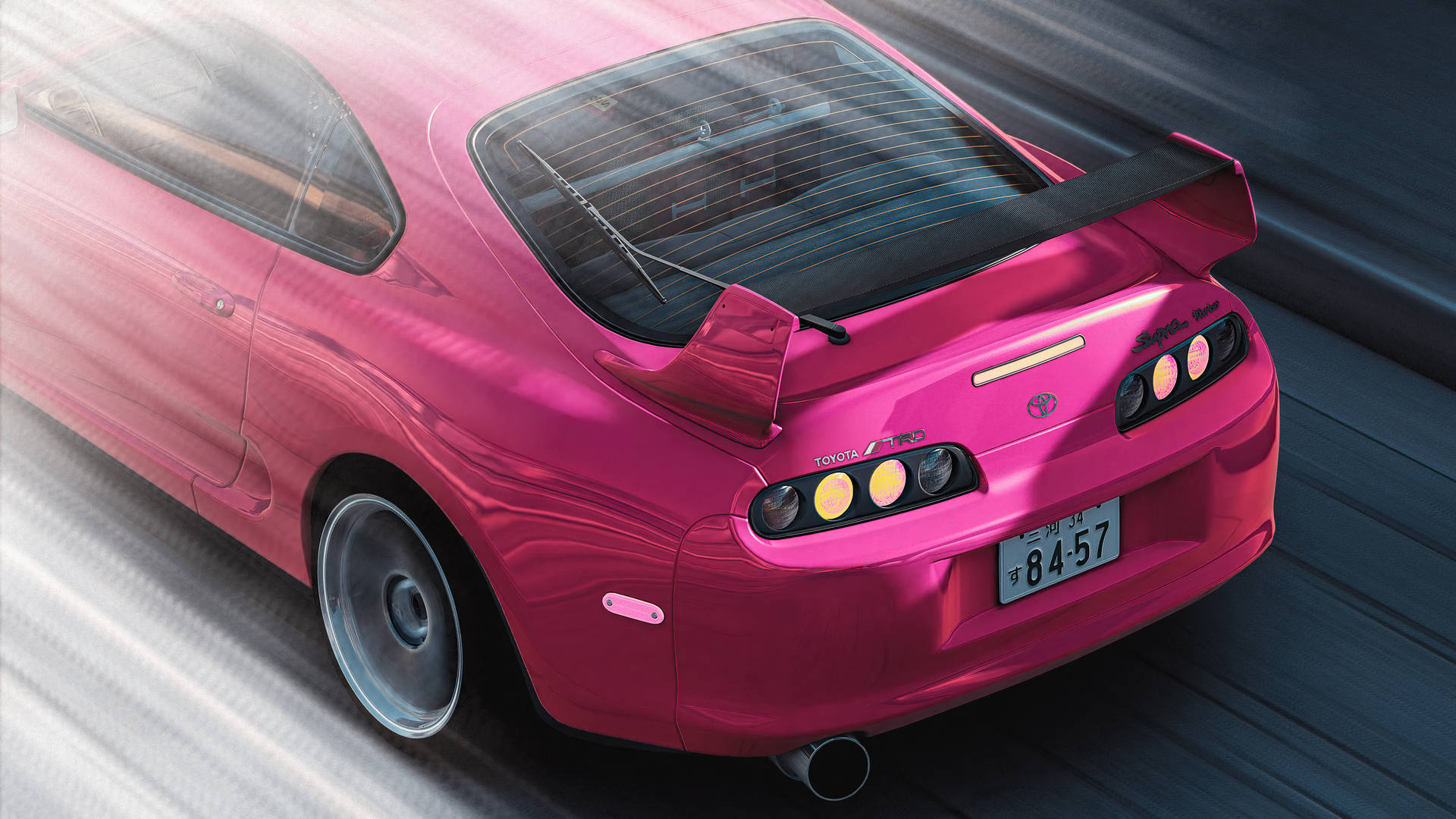 粉紅色豐田Supra在道路上疾馳，帶有動態模糊 — Toyota Supra 壁紙