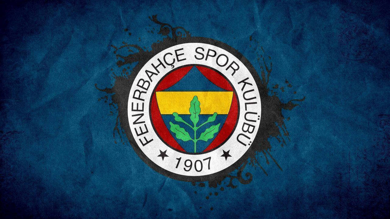 Fenerbahce 桌布 壁紙 — Fenerbahçe Spor Kulübü 徽章居中置於帶有黑色潑濺效果的紋理藍色背景上。