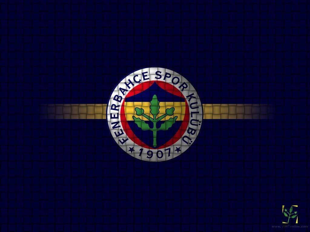 Fenerbahce 桌布 壁紙 — Fenerbahce Spor Kulubu 標誌居中於深藍色瓷磚背景上，帶有水平金色條紋。