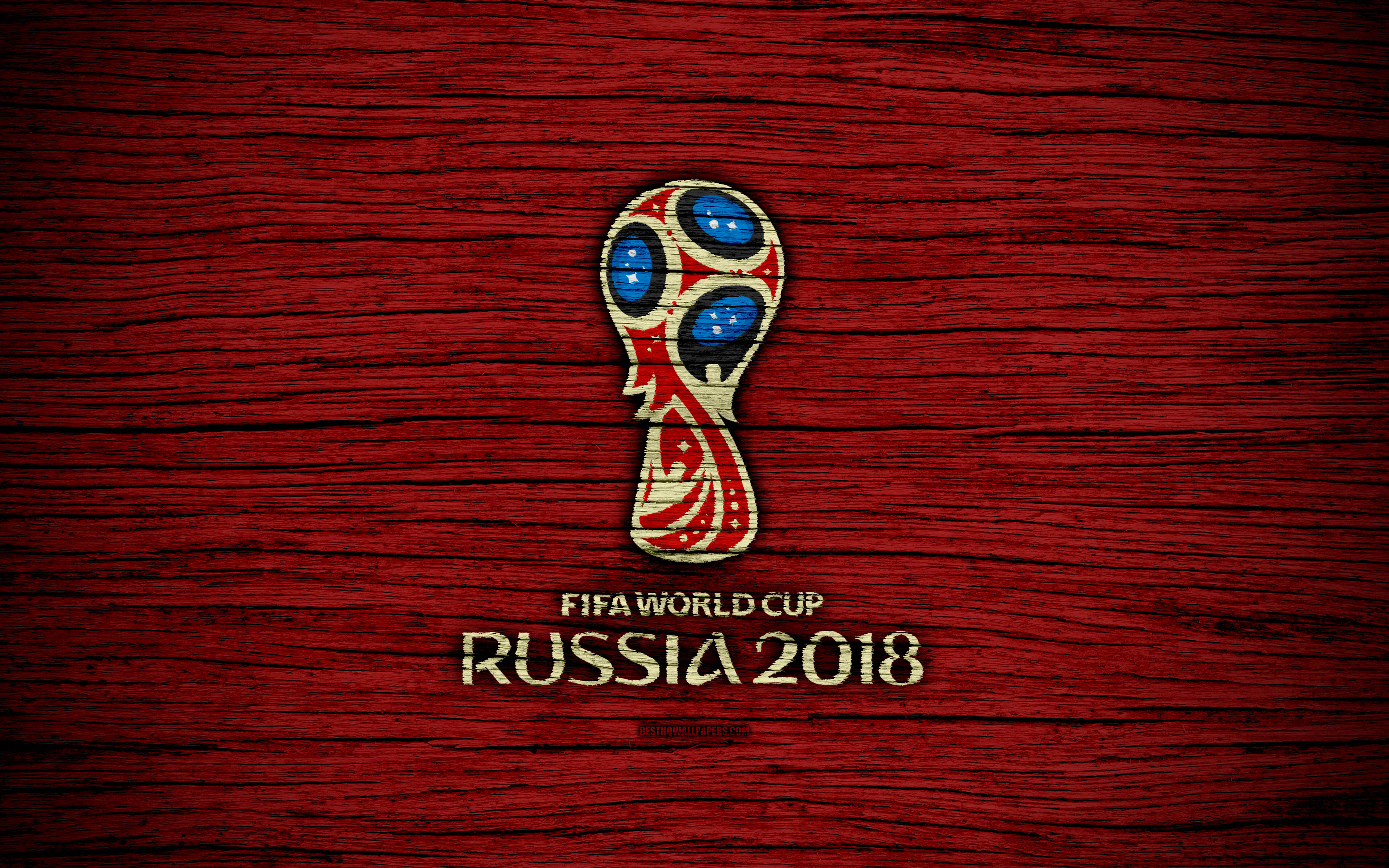 World 桌布 壁紙 — FIFA世界盃俄羅斯2018標誌居中於有紋理的深紅色木質背景上。