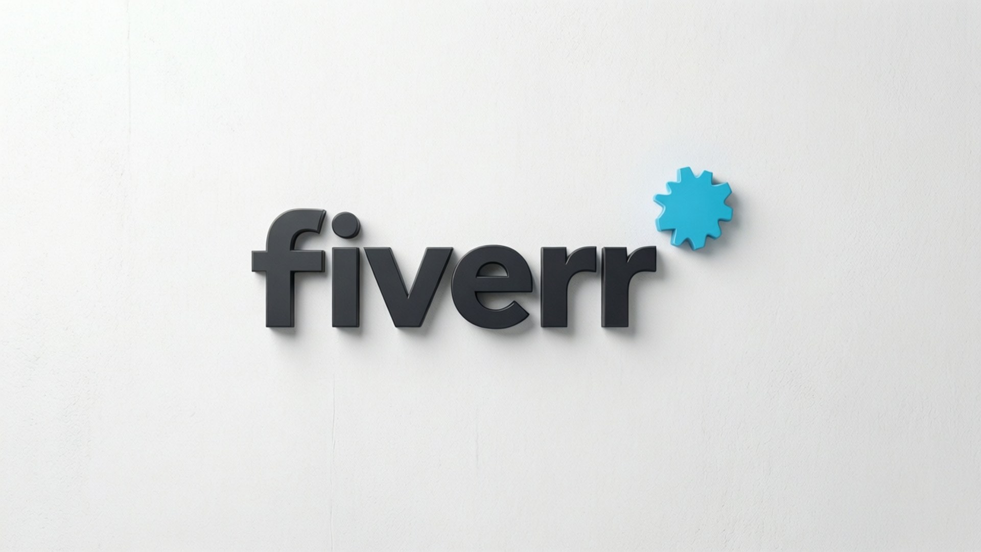 Fiverr 桌布 壁紙 — Fiverr 標誌以深灰色 3D 字體呈現，帶有藍色齒輪圖示，安裝在純白色牆壁上。