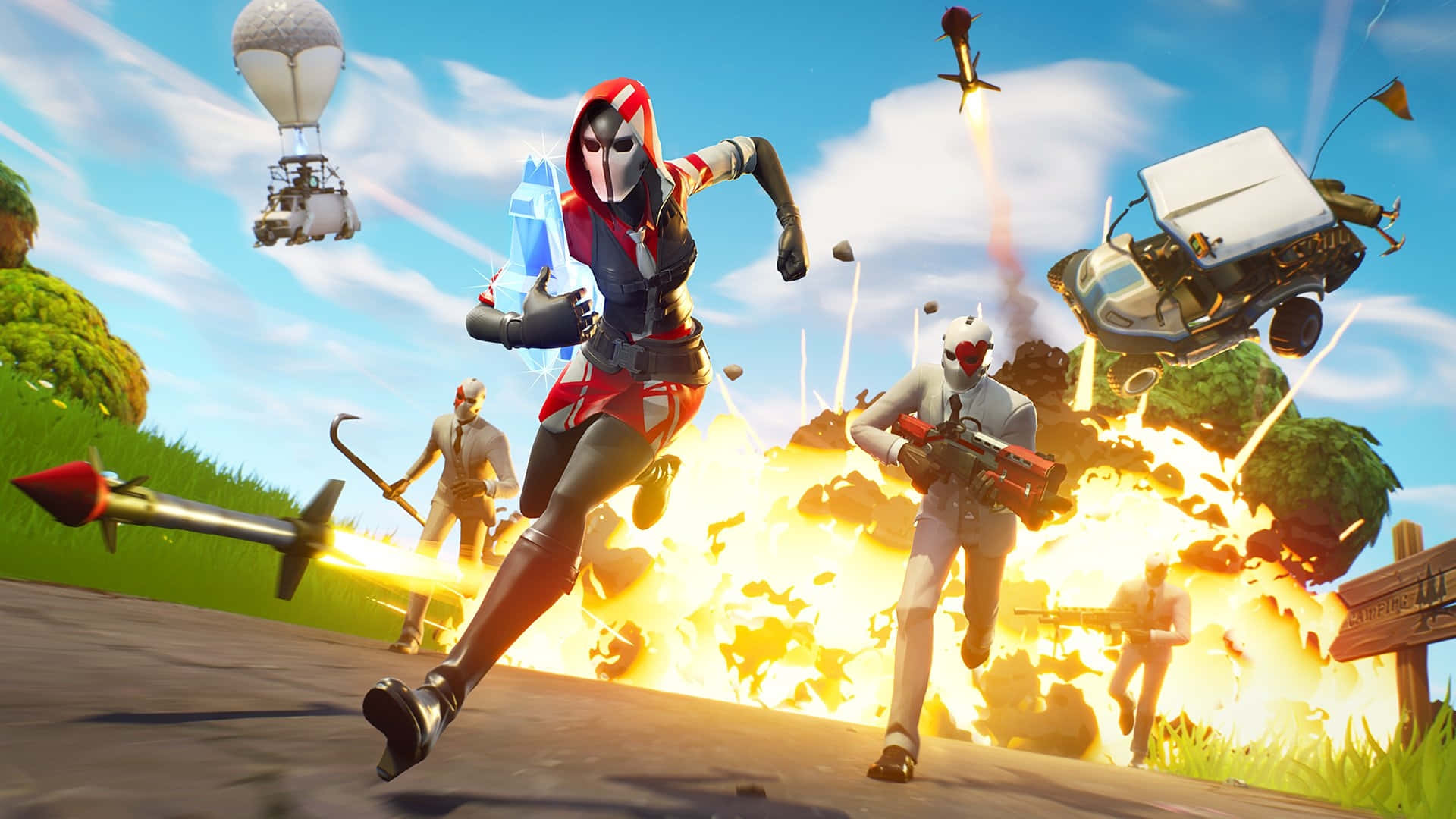  壁紙 — 一個穿著紅色和黑色裝備的Fortnite角色在混亂的戰場上奔跑，戰場上有爆炸、飛行車輛和天空中的熱氣球。