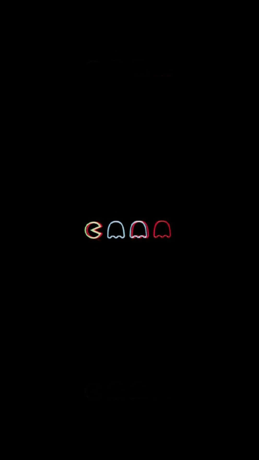  壁紙 — 四個發光的 Pac-Man 鬼魂，以紅色、藍色和橙色霓虹燈呈現，背景為漆黑一片。