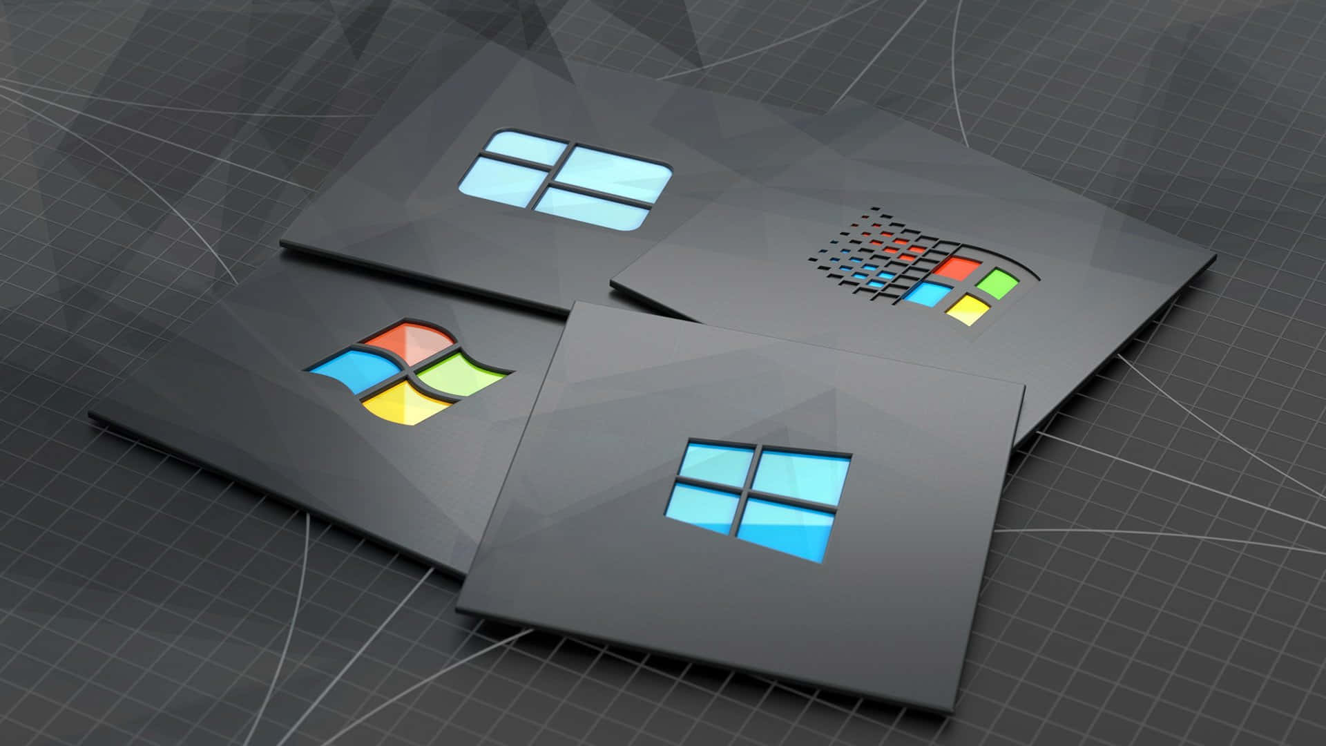  壁紙 — 四個Microsoft標誌版本展示在時尚的黑色面板上，排列在網格圖案表面上。