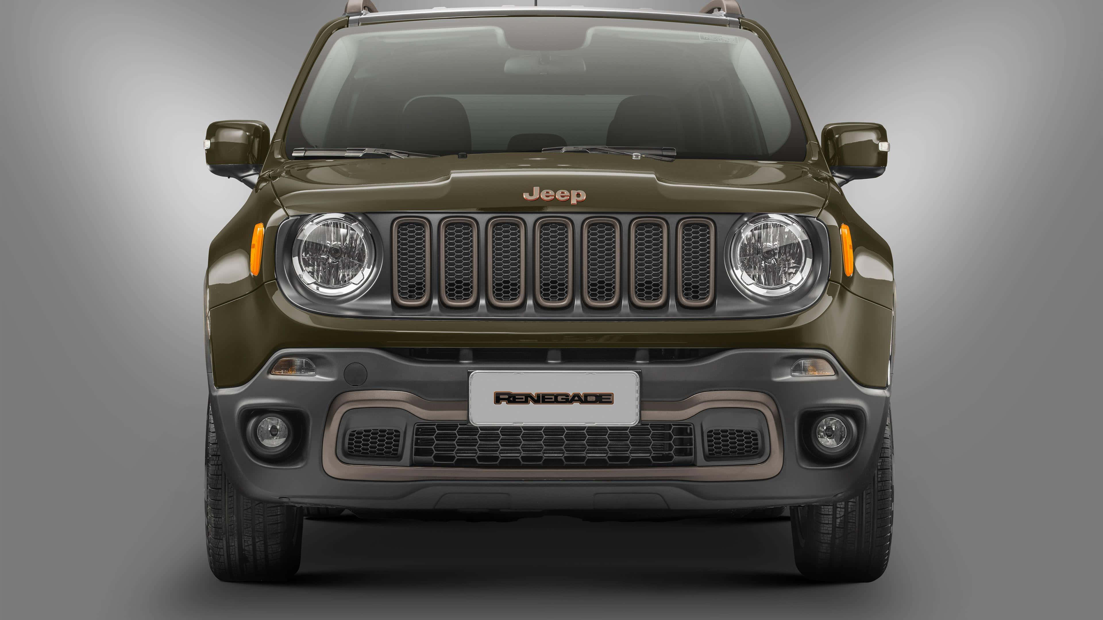 Jeep Renegade 桌布 壁紙 — 啞光橄欖綠色 Jeep Renegade SUV 正面視圖，背景為中性灰色工作室背景。