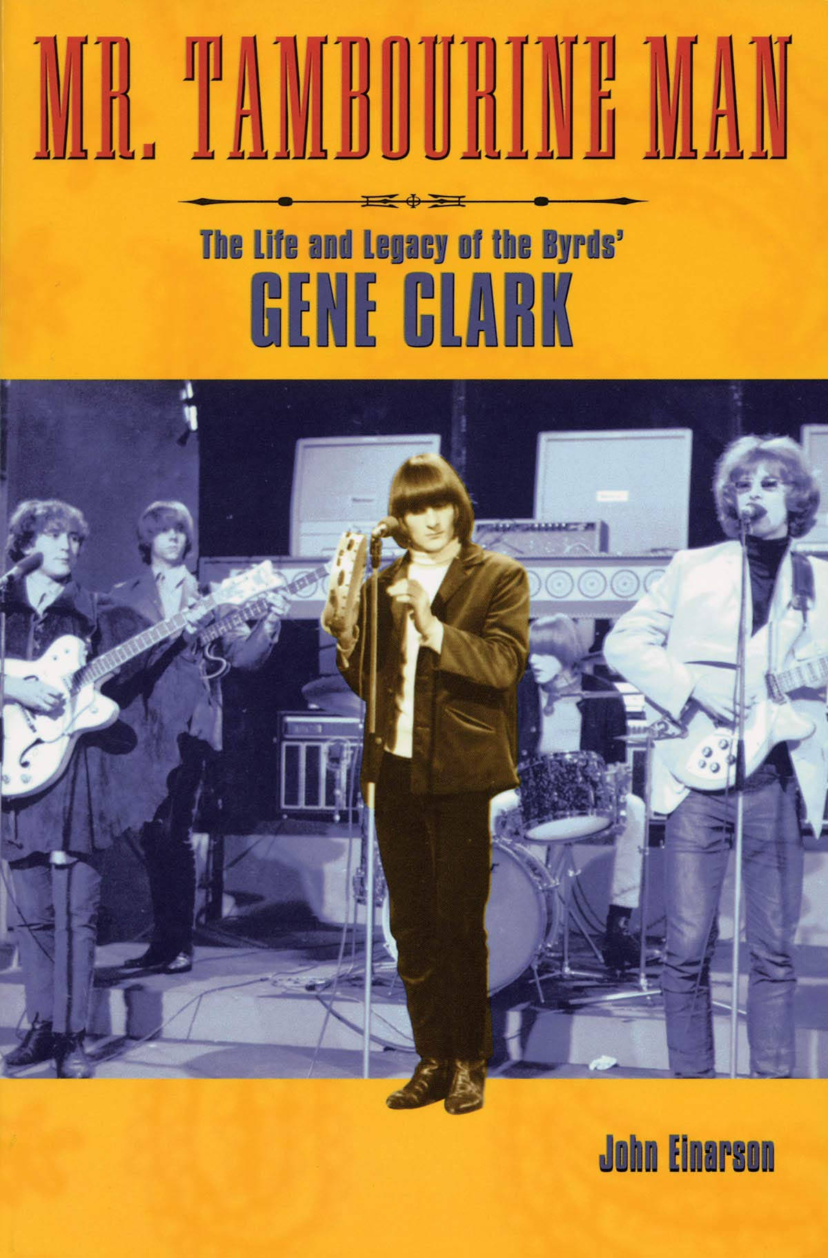 Rock 桌布 壁紙 — Gene Clark 和 The Byrds 在舞台上用吉他和擴音器在溫暖黃色燈光下現場表演的復古照片。