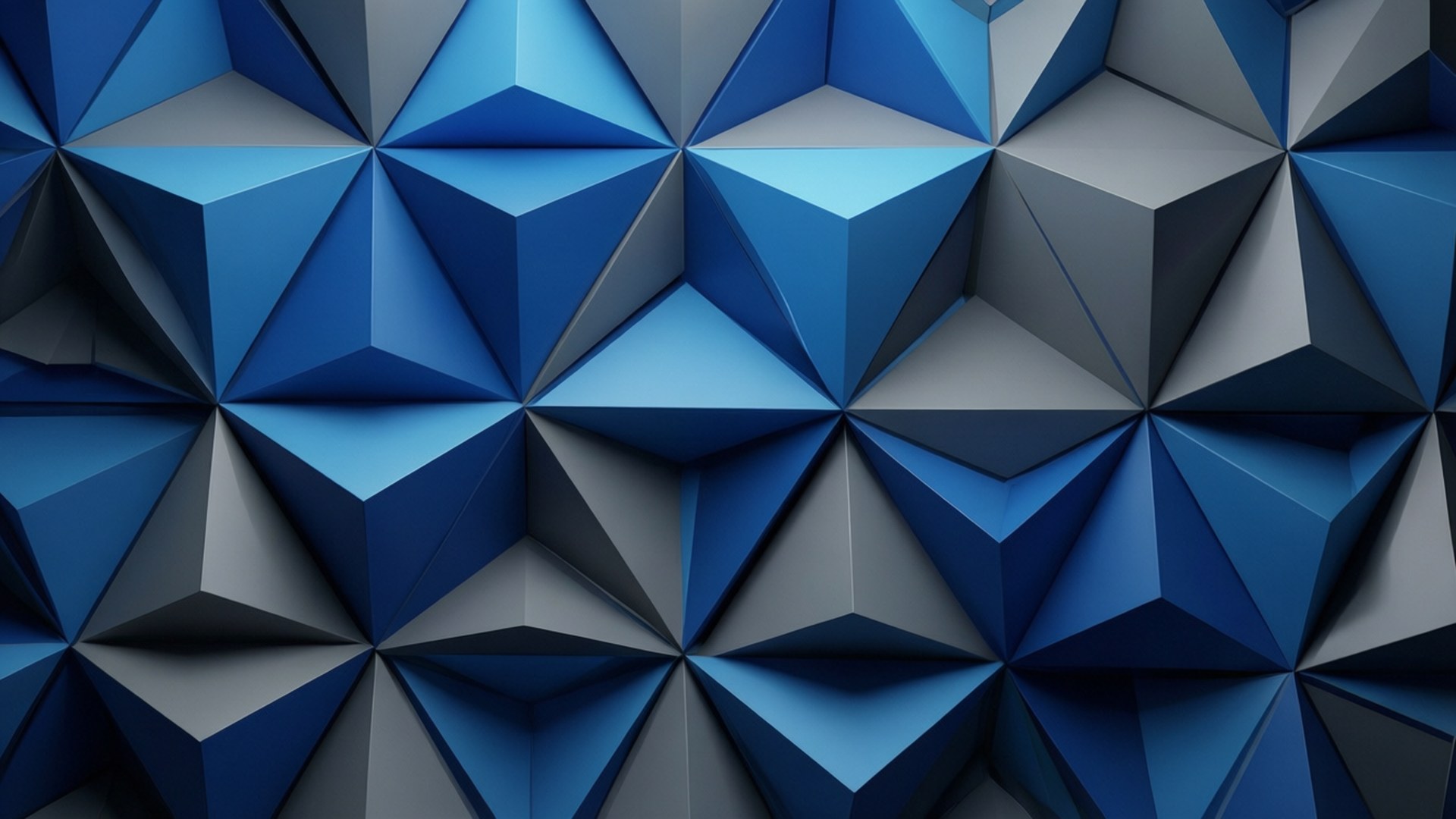 Low-Poly OnePlus Blue 壁紙 — 一款幾何壁紙，重複的藍色和灰色三角形切面營造出3D低多邊形效果。