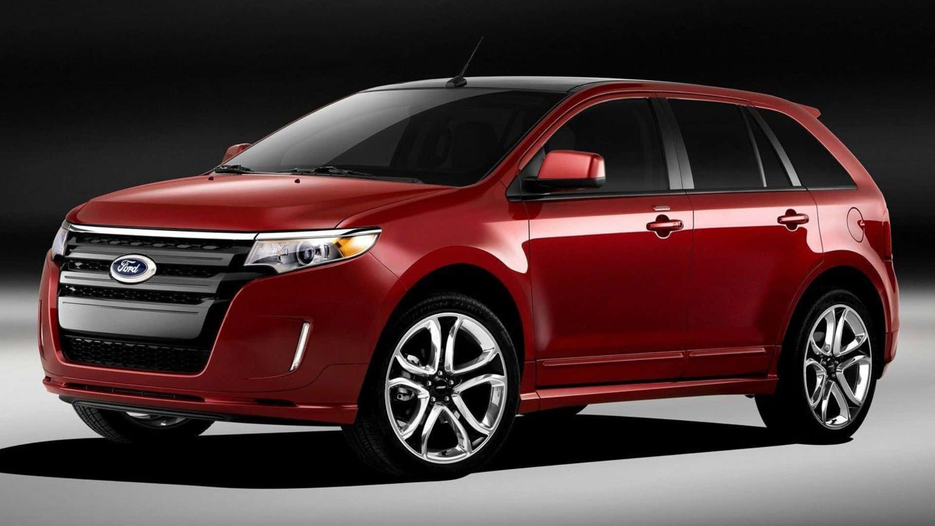 Ford Edge 桌布 壁紙 — 一輛光澤的紅色福特Edge SUV在攝影棚中展示，配有戲劇性燈光和深色漸變背景。