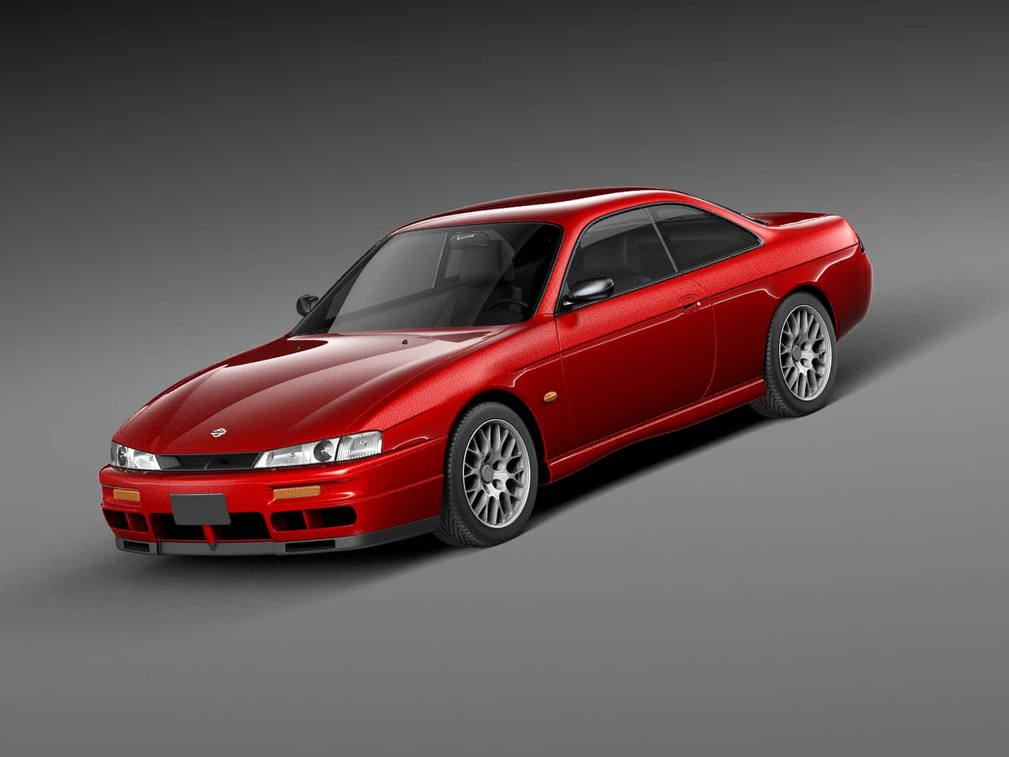  壁紙 — 一輛光澤的紅色日產Skyline R34雙門轎車配銀色輪圈，在漸變灰色工作室背景前靜立。