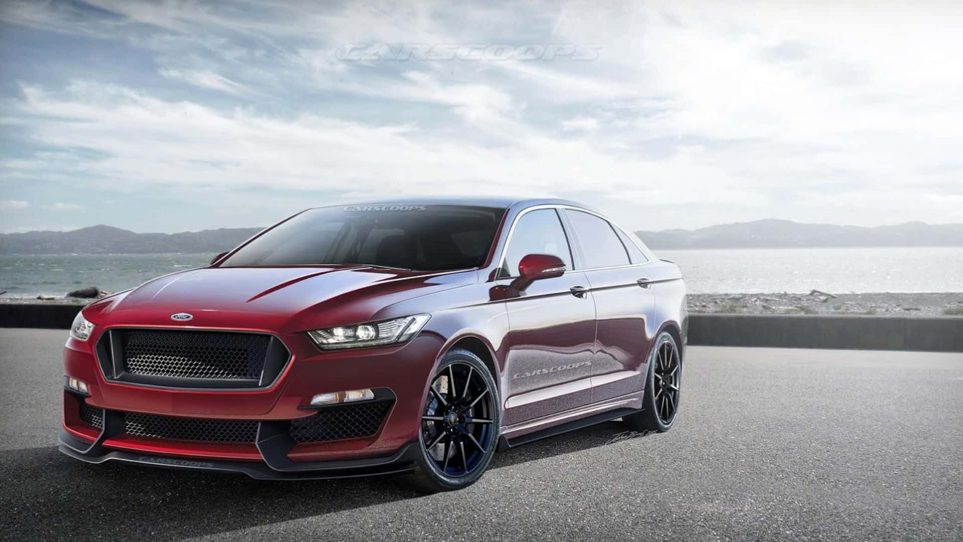 Ford Taurus 桌布 壁紙 — 一輛光澤紅色高性能轎車配黑色輪圈，停泊在俯瞰平靜大海的海岸公路上，天空多雲。