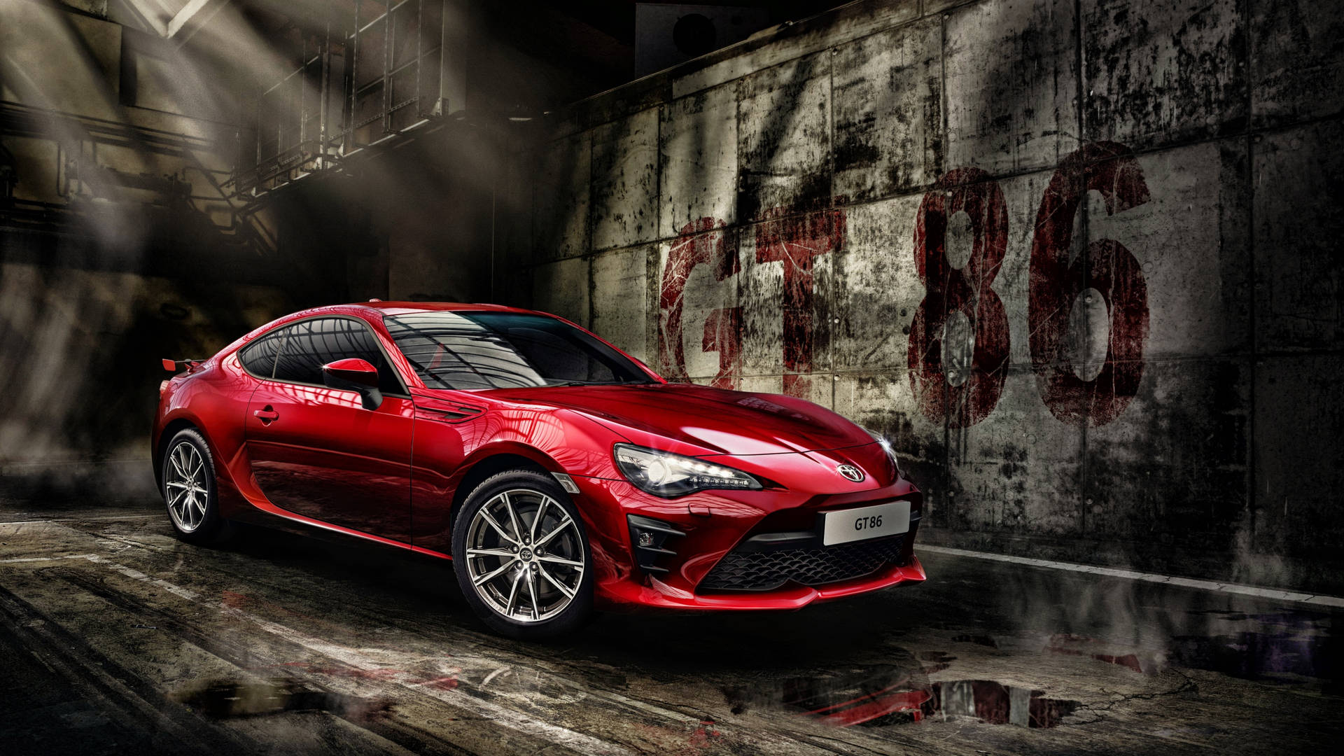 紅色跑車停在佈滿塗鴉的車庫中，帶有煙霧效果。 — Toyota Supra 壁紙