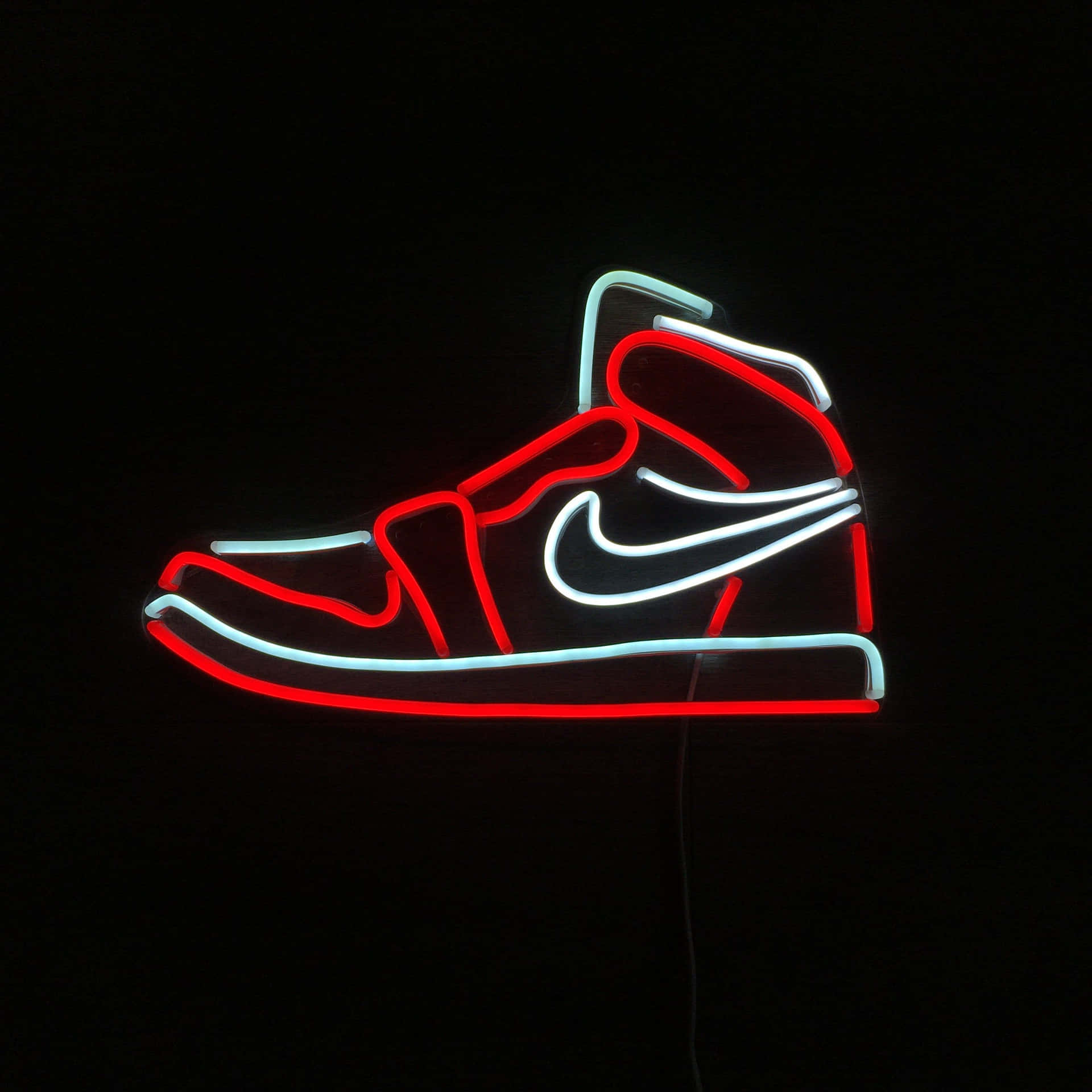 黑色背景上紅白高筒運動鞋的霓虹輪廓。 — Jordan Logo 壁紙