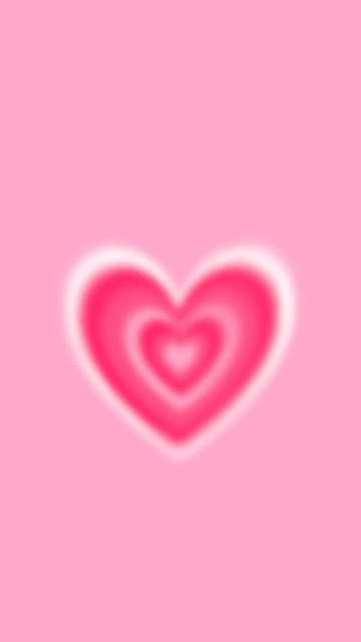 Pink Heart Aura 桌布 壁紙 — 柔和粉紅色背景上有一個發光的心形，帶有同心層，漸變至白色邊緣。