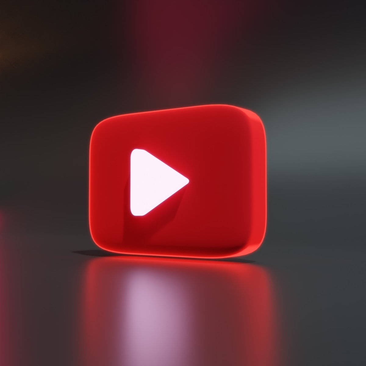 在暗色反光表面上發光的紅色YouTube播放按鈕圖示。 — 3D 壁紙