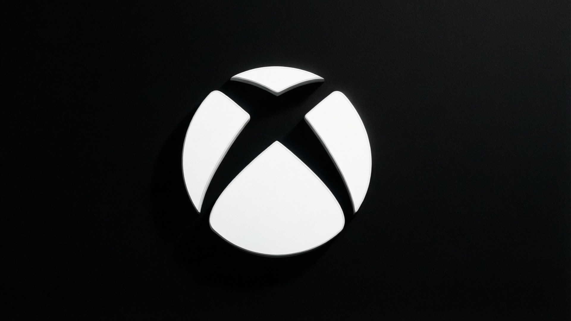 White Xbox Logo on Black 壁紙 — 在霧面黑色背景上，帶有柔和陰影的發光白色Xbox標誌居中。