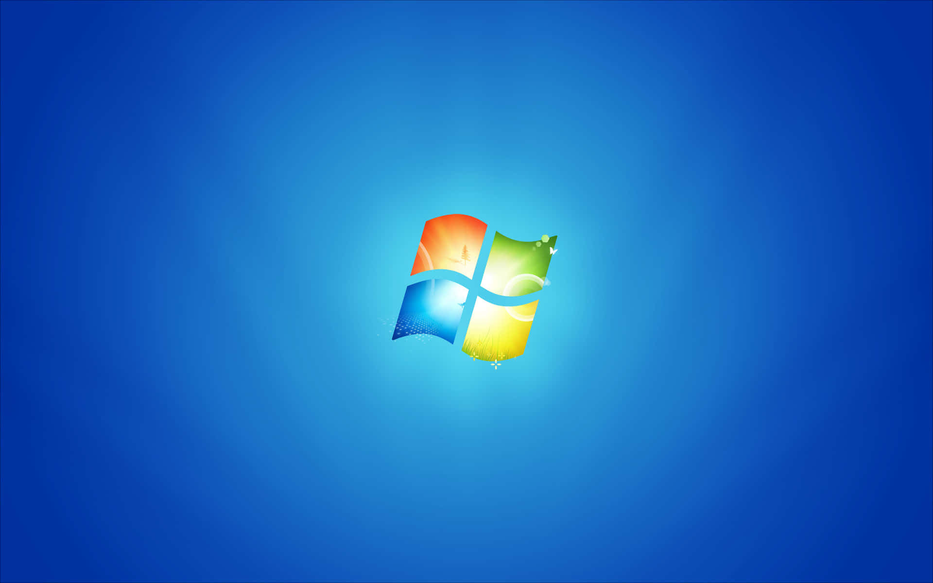 Windows標誌，彩色窗格在藍色漸變背景上 — Windows 7 壁紙