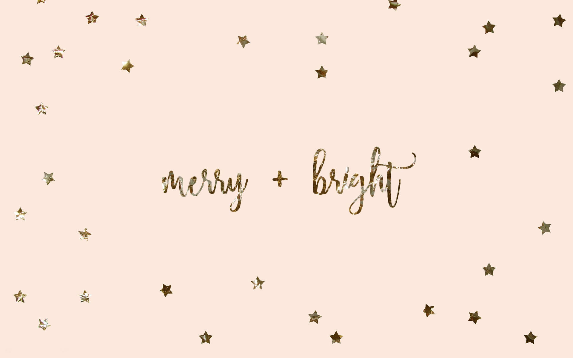 腮紅背景上散落著金色星星和閃爍的「merry bright」文字。 — Macbook Pro 壁紙
