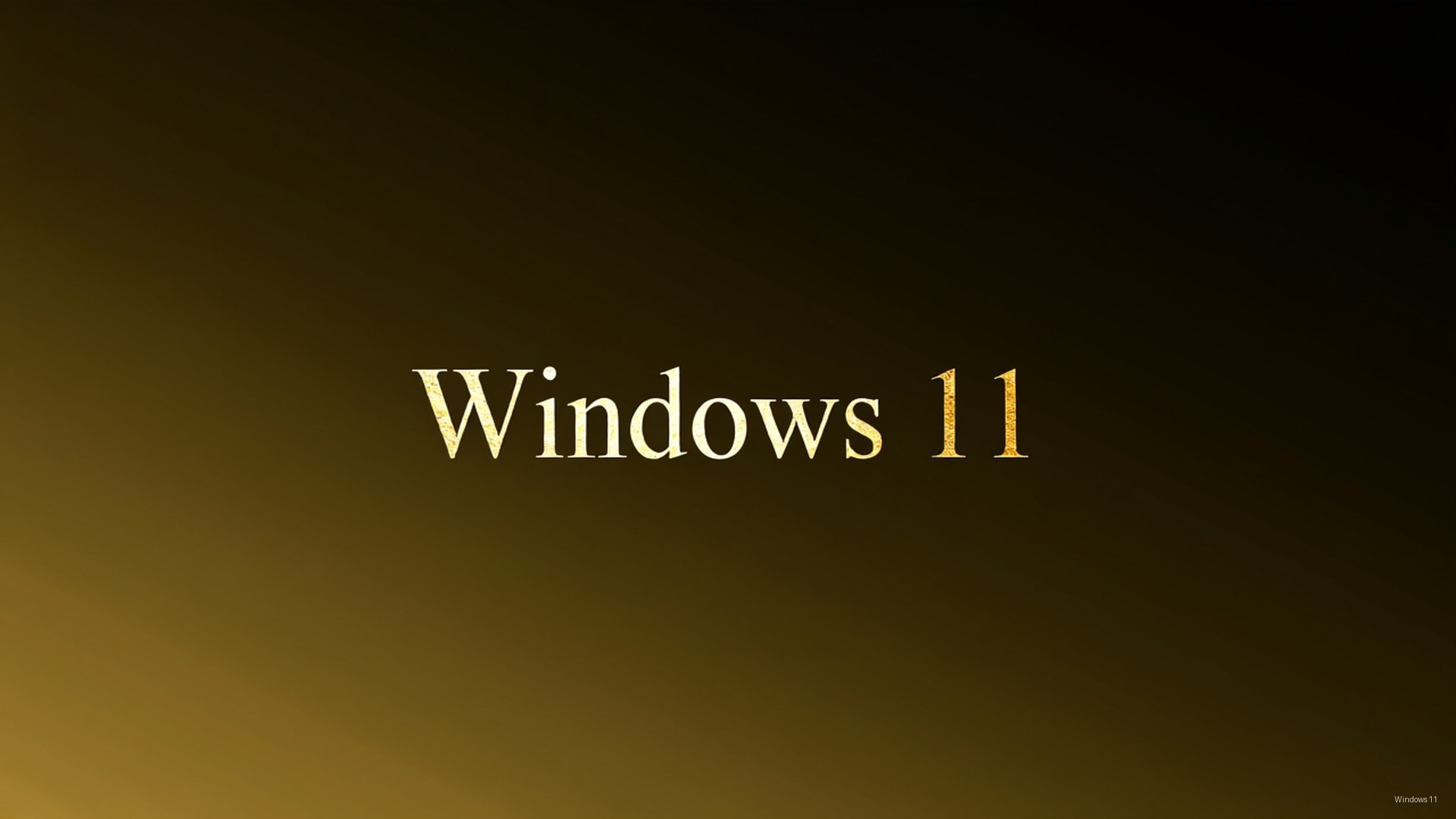 Windows 11 標誌以金色文字顯示於由深色漸變至金色的背景上 — Windows 11 壁紙