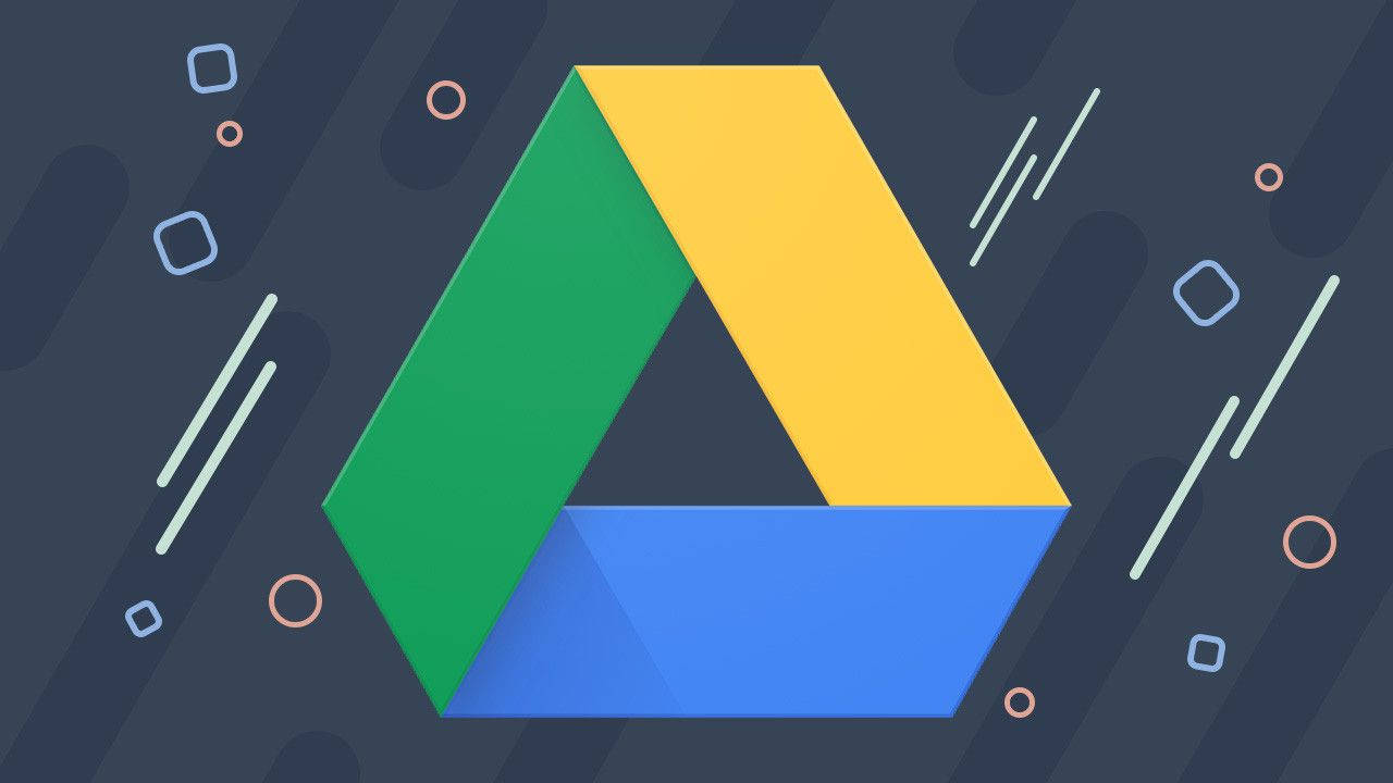 Software 桌布 壁紙 — Google Drive 標誌以大膽的綠色、黃色和藍色幾何形狀呈現，背景為深色抽象背景，帶有浮動形狀。