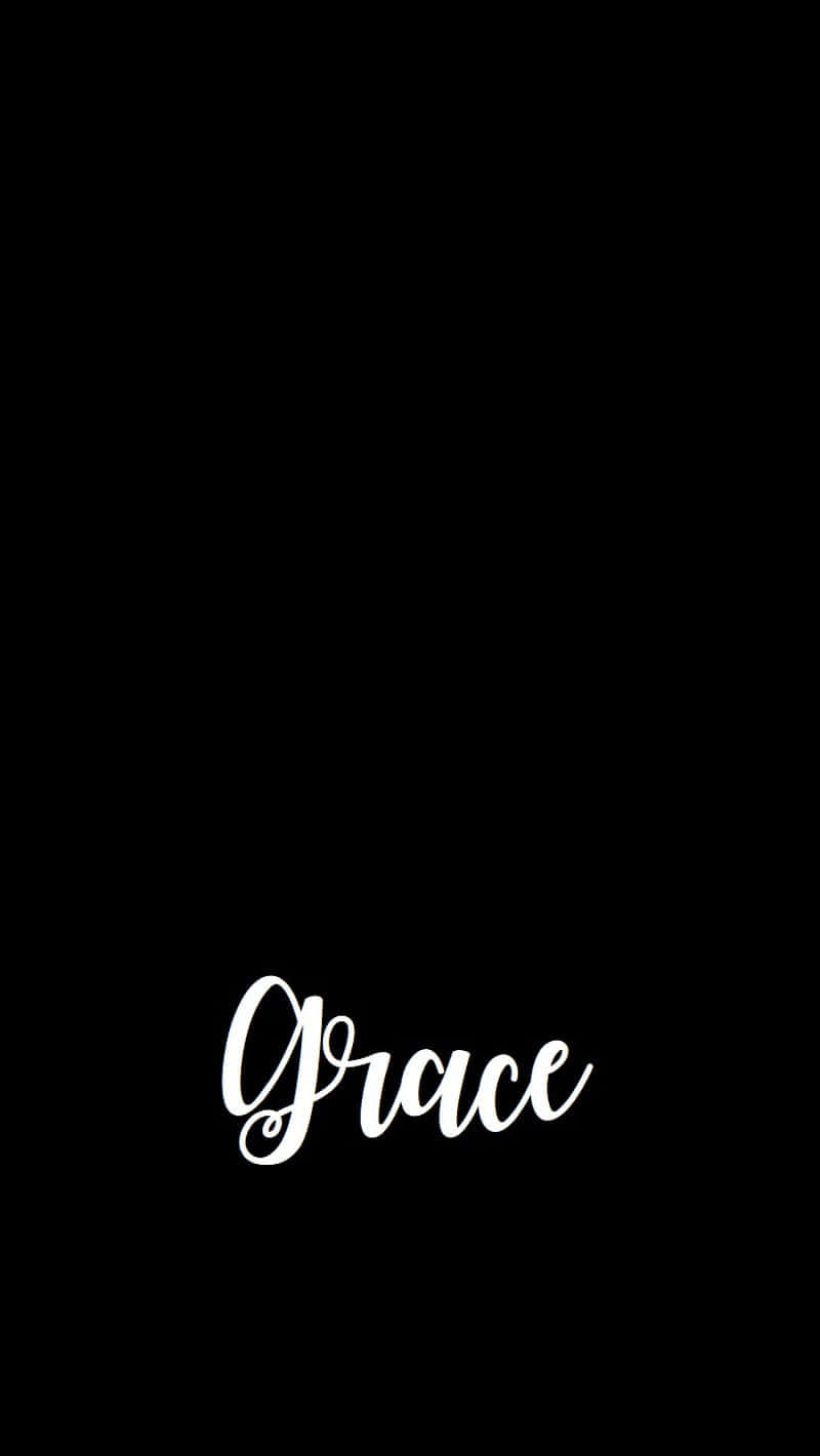 grace 桌布 壁紙 — 「grace」一詞以優雅的白色草書字體居中顯示在純黑色背景上。
