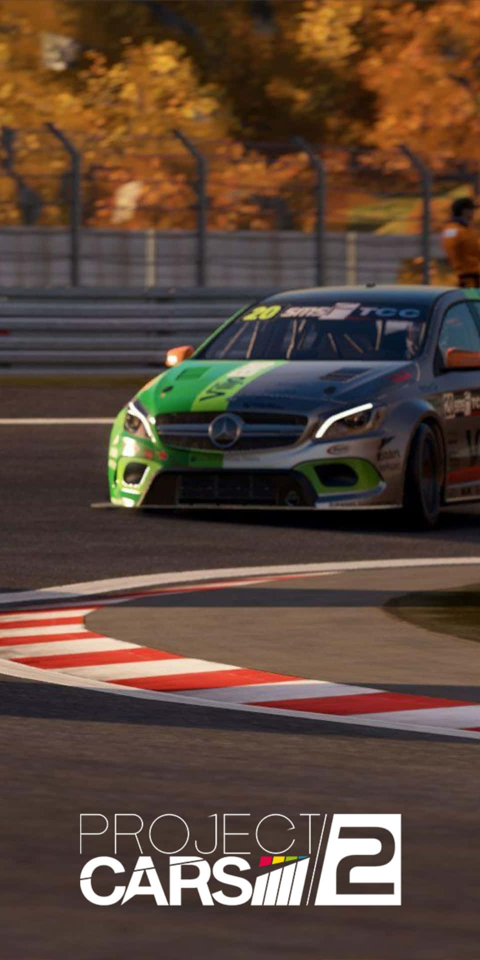 綠色和黑色的賽車在賽道彎道，背景有秋樹。 — Project Cars 2 壁紙