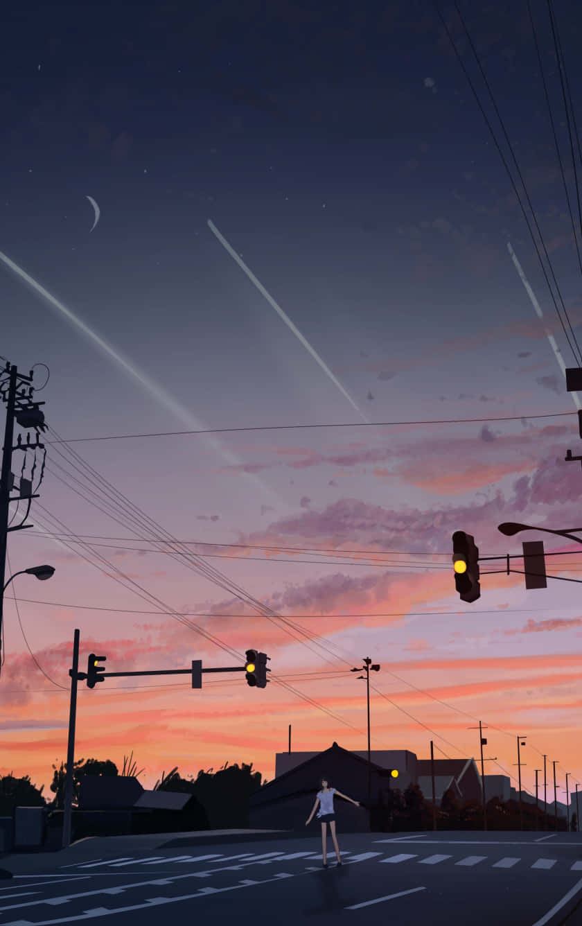  壁紙 — 一個孤獨的身影站在街頭十字路口，夕陽以粉紅、橙和紫色渲染天空，光線劃破暮色。