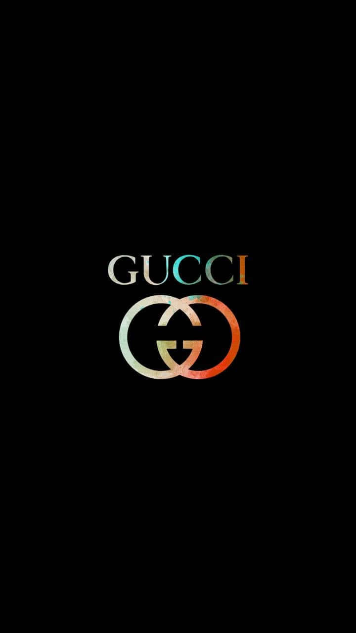 Gucci 桌布 壁紙 — Gucci 標誌，漸變顏色，居中於黑色背景上。