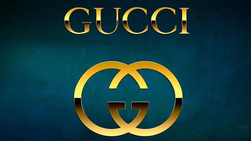 Gucci標誌在金色中，帶有紋理的深青色背景。 — Gucci GIF 壁紙