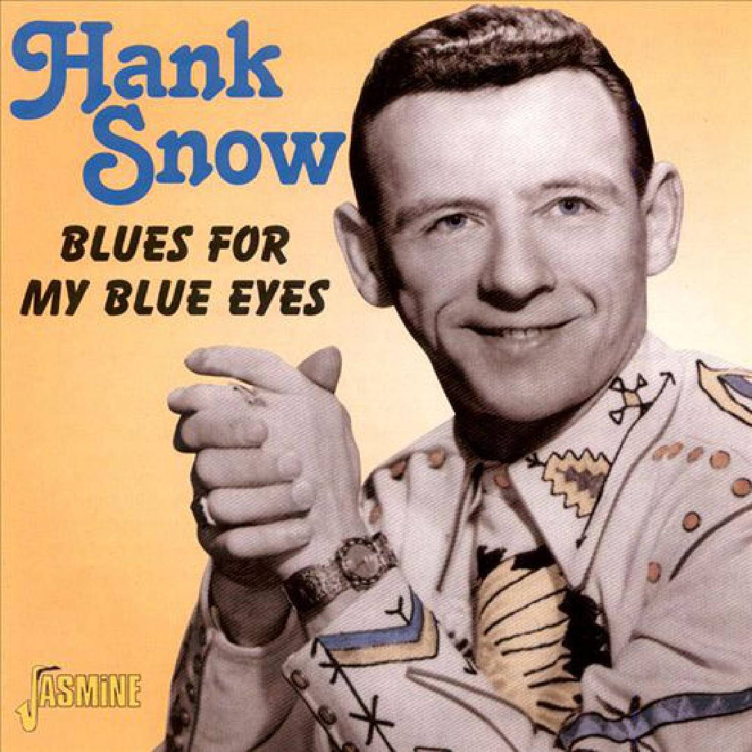音樂 桌布 壁紙 — Hank Snow 穿著圖案西部襯衫，在溫暖黃色背景的復古專輯封面上指向觀眾。