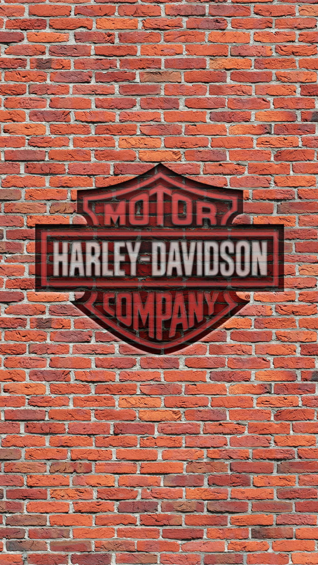 紅磚牆上的 Harley-Davidson 標誌 — 哈雷戴維森 GIF 壁紙