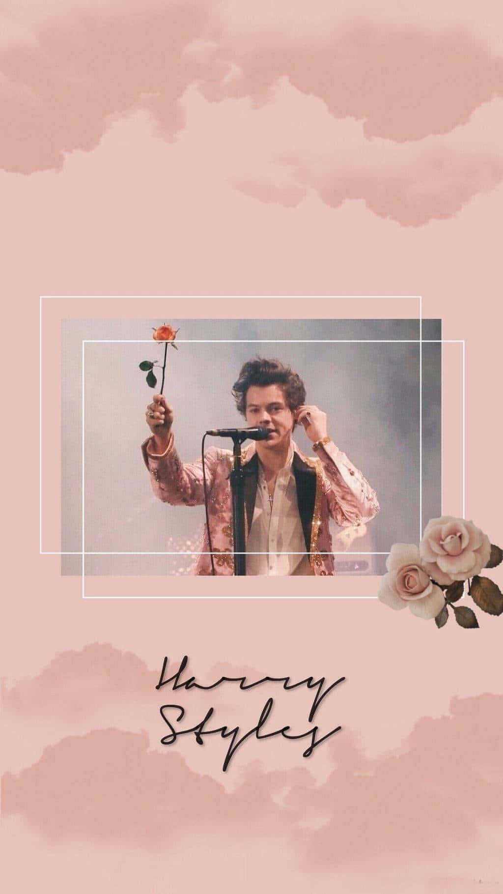 哈利·史泰爾斯 桌布 壁紙 — Harry Styles 手持玫瑰，在柔和的粉紅色水彩天空和漂浮玫瑰的背景前對著麥克風唱歌。