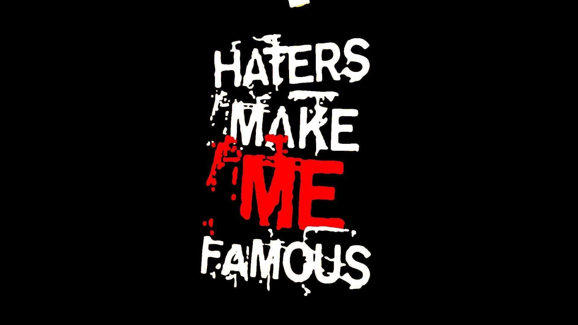  壁紙 — 大膽的塗鴉風格文字 'HATERS MAKE ME FAMOUS'，其中 'ME' 是紅色，襯托在鮮明的黑色背景上。