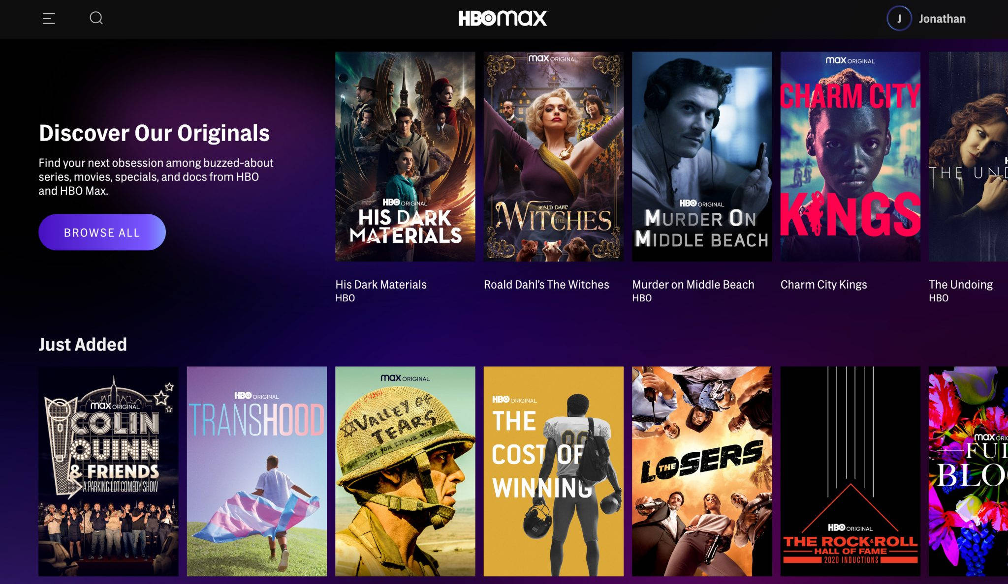 HBO 桌布 壁紙 — HBO Max 首頁顯示一個色彩繽紛的節目海報網格，包括 His Dark Materials 和 The Witches，背景為深紫色。
