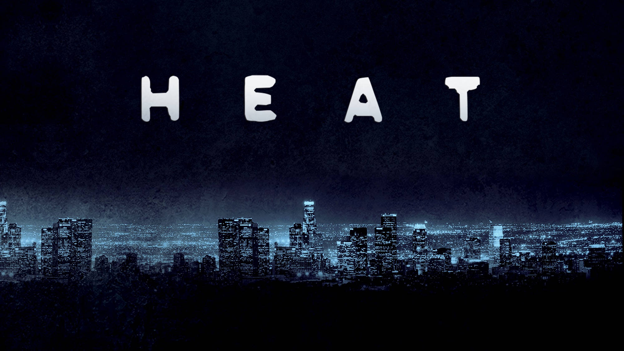 城市 桌布 壁紙 — HEAT 這個詞在夜晚深藍色霓虹燈照亮的城市天際線上方以醒目的白色字母發光。