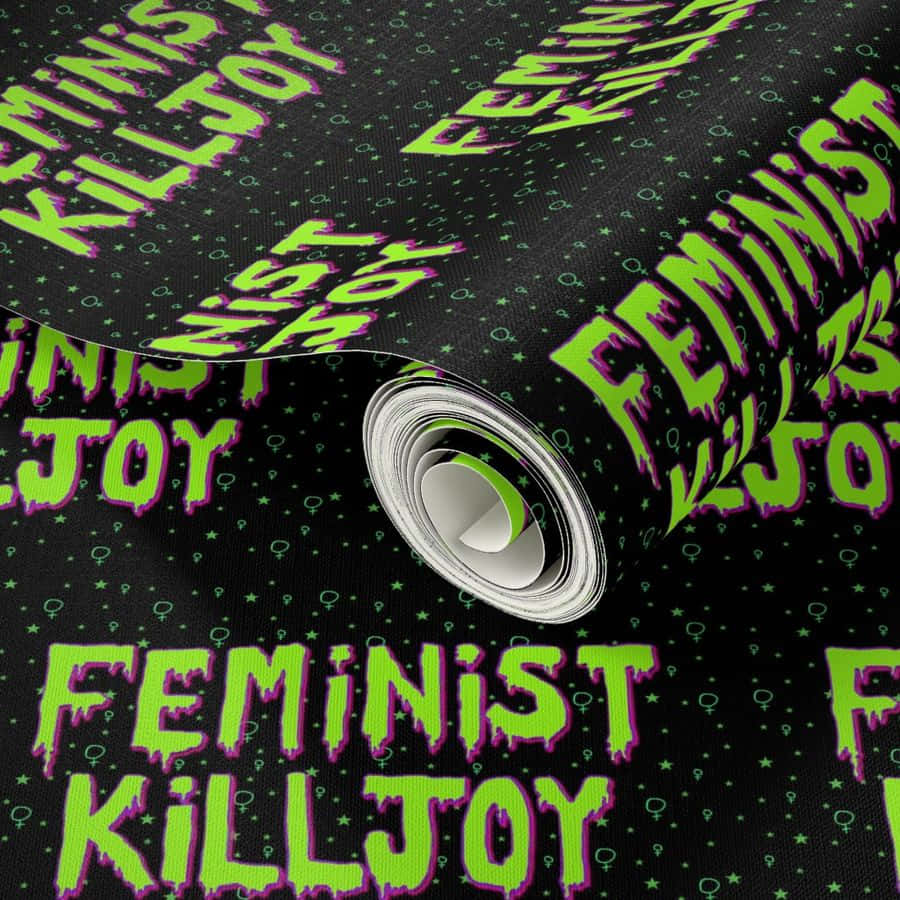  壁紙 — 一卷黑色壁紙，帶有霓虹綠色滴落文字，寫著 feminist killjoy 和女性符號。