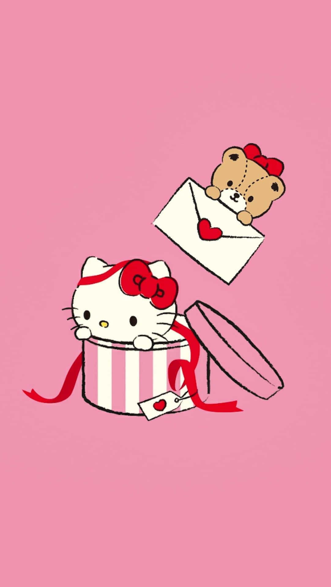  壁紙 — Hello Kitty 和一隻泰迪熊從一個帶有紅色絲帶和心形標籤的條紋禮物盒中探出頭來，背景是純粉紅色。