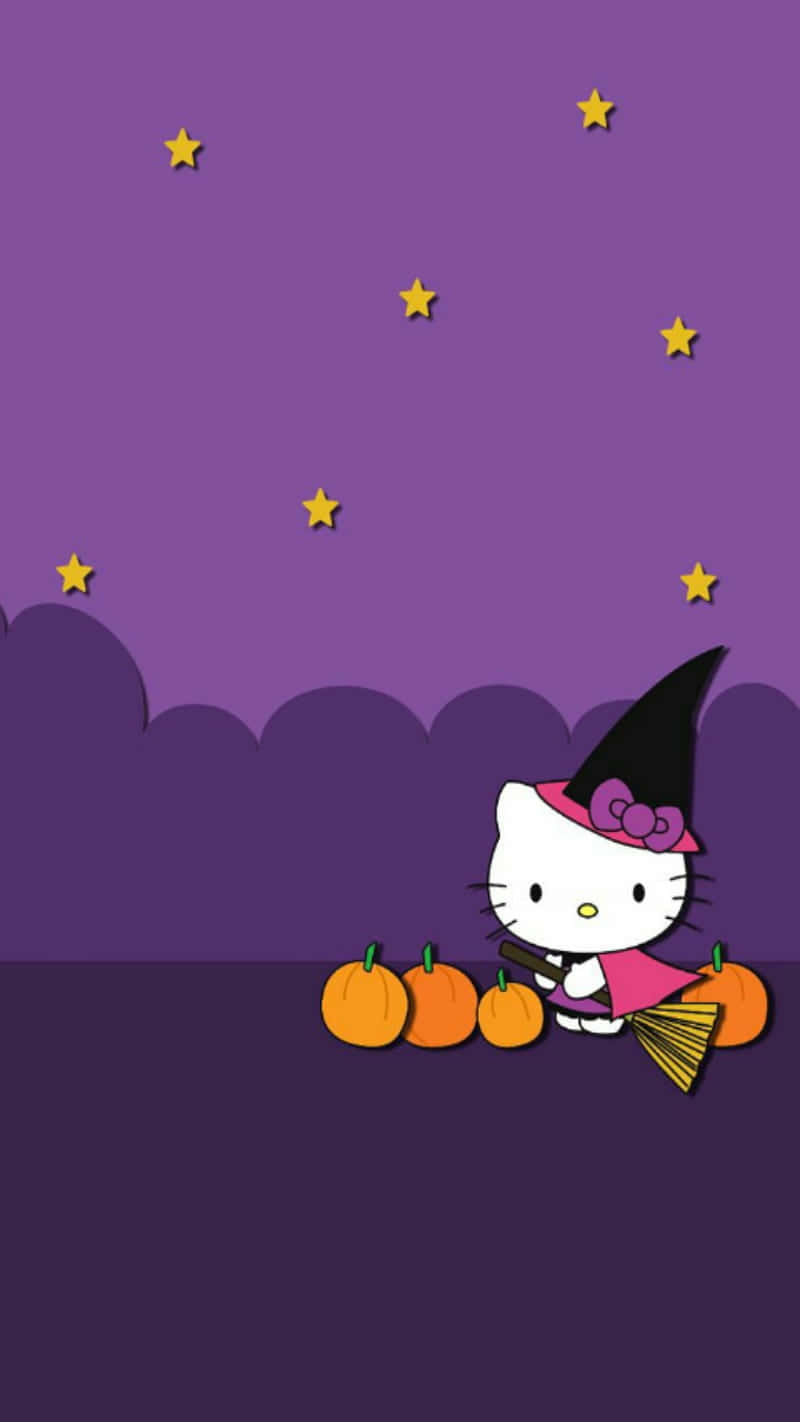 壁紙 — Hello Kitty 打扮成女巫，拿著掃帚和南瓜，在佈滿星星的紫色天空下。