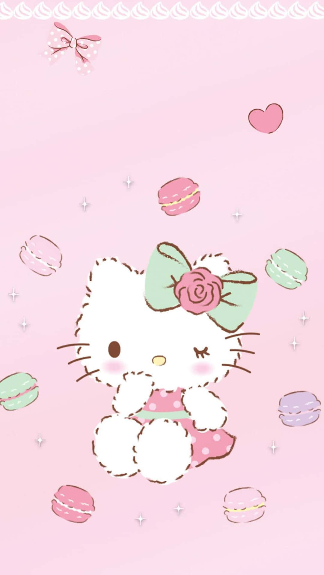 Hello Kitty 被馬卡龍和心形圖案包圍在粉紅色背景上 — Hello Kitty 壁紙
