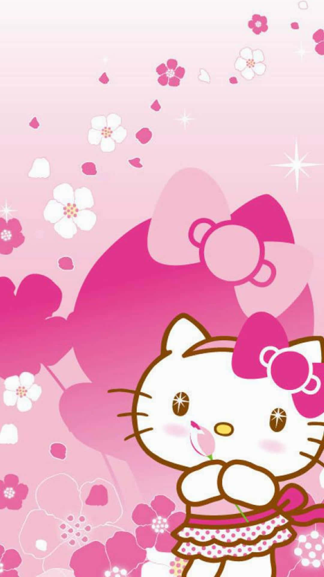  壁紙 — Hello Kitty 在柔和的粉紅色背景上拿著一朵粉紅色的花，周圍有飄浮的櫻花和閃爍的光芒。