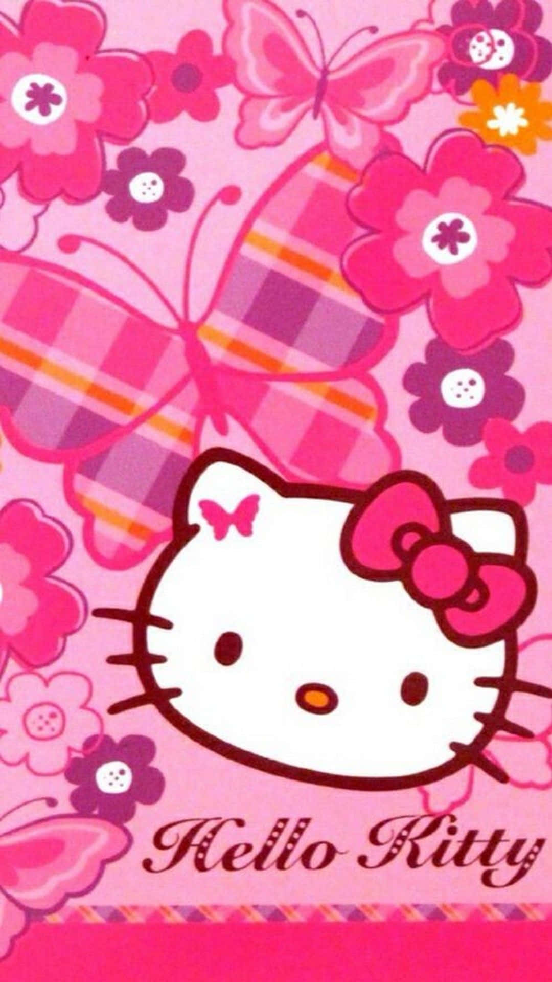 Hello Kitty 桌布 壁紙 — Hello Kitty 卡通臉孔置於粉紅色花朵和蝴蝶之間，背景為鮮豔的粉紅色。