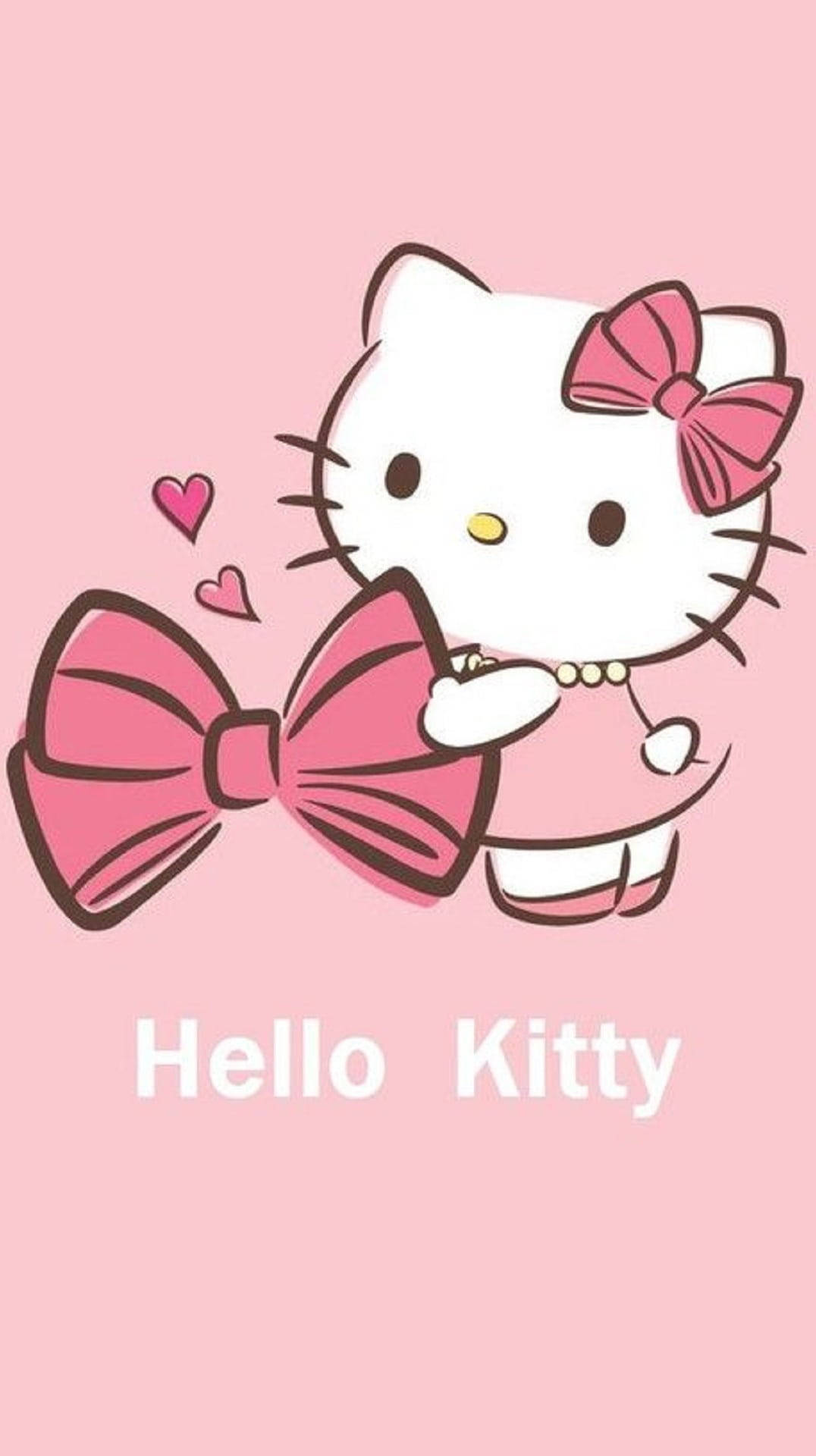 Pink Hello Kitty 桌布 壁紙 — Hello Kitty 卡通角色穿著粉紅色連衣裙，在帶有漂浮心形的柔和粉紅色背景前拿著一個巨大的粉紅色蝴蝶結。
