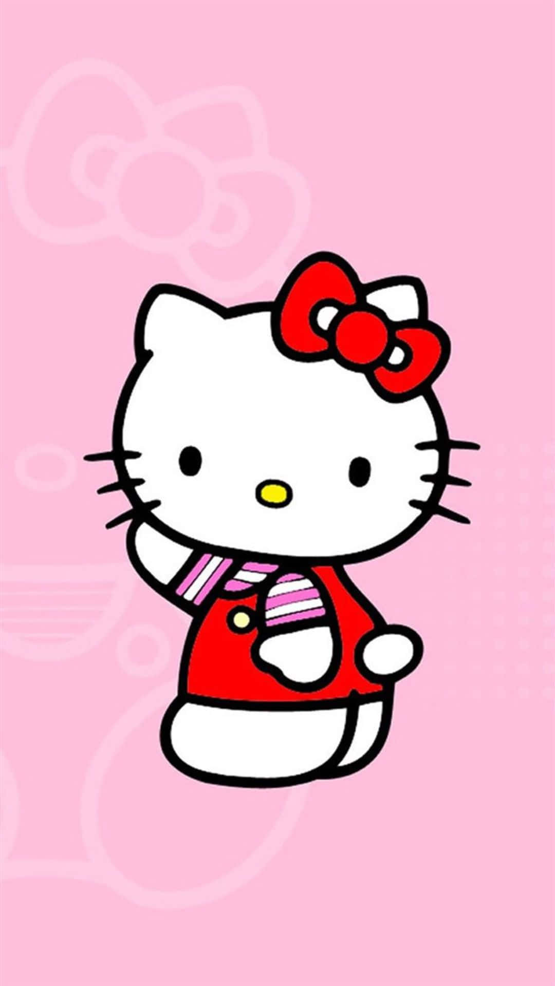 Kawaii Cartoon 桌布 壁紙 — Hello Kitty 卡通角色身穿紅色服裝和蝴蝶結，在帶有淡淡蝴蝶結圖案的粉紅色背景上揮手。