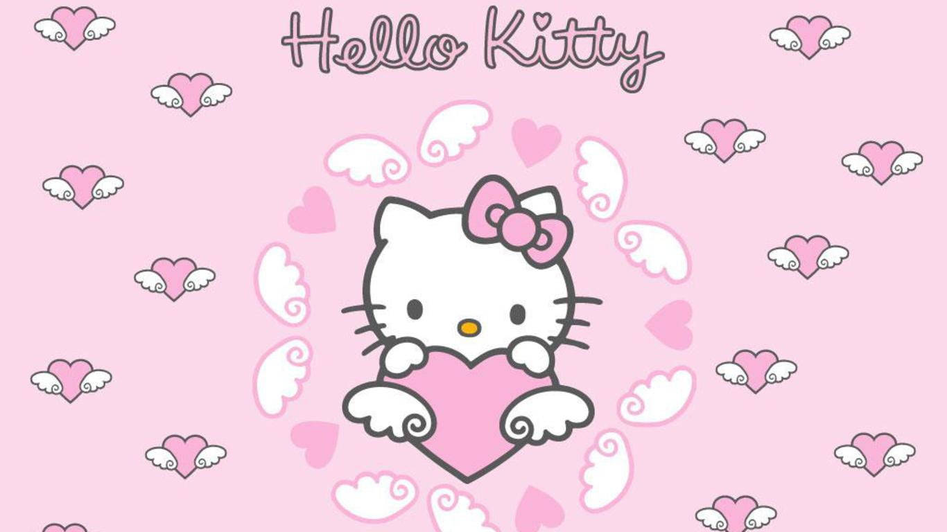 sanrio 桌布 壁紙 — Hello Kitty 在柔和粉紅色背景上，手持一個被漂浮愛心和翅膀包圍的粉紅色愛心。