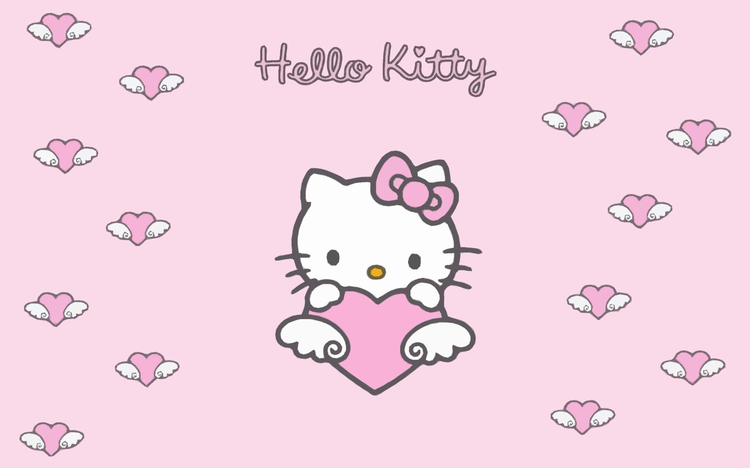 Kitty White 桌布 壁紙 — Hello Kitty 在柔和粉紅色背景上，手持一個被飄浮有翼愛心包圍的粉紅色愛心。