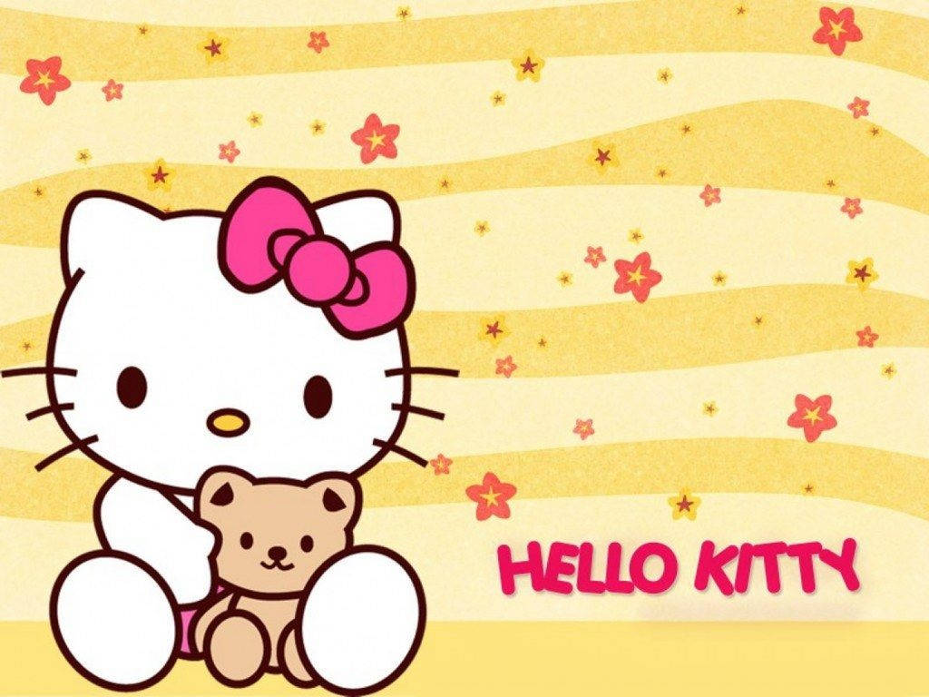 Hello Kitty 桌布 壁紙 — Hello Kitty 在黃色條紋背景上抱著一隻泰迪熊，背景有粉紅色星星和文字 hello kitty。