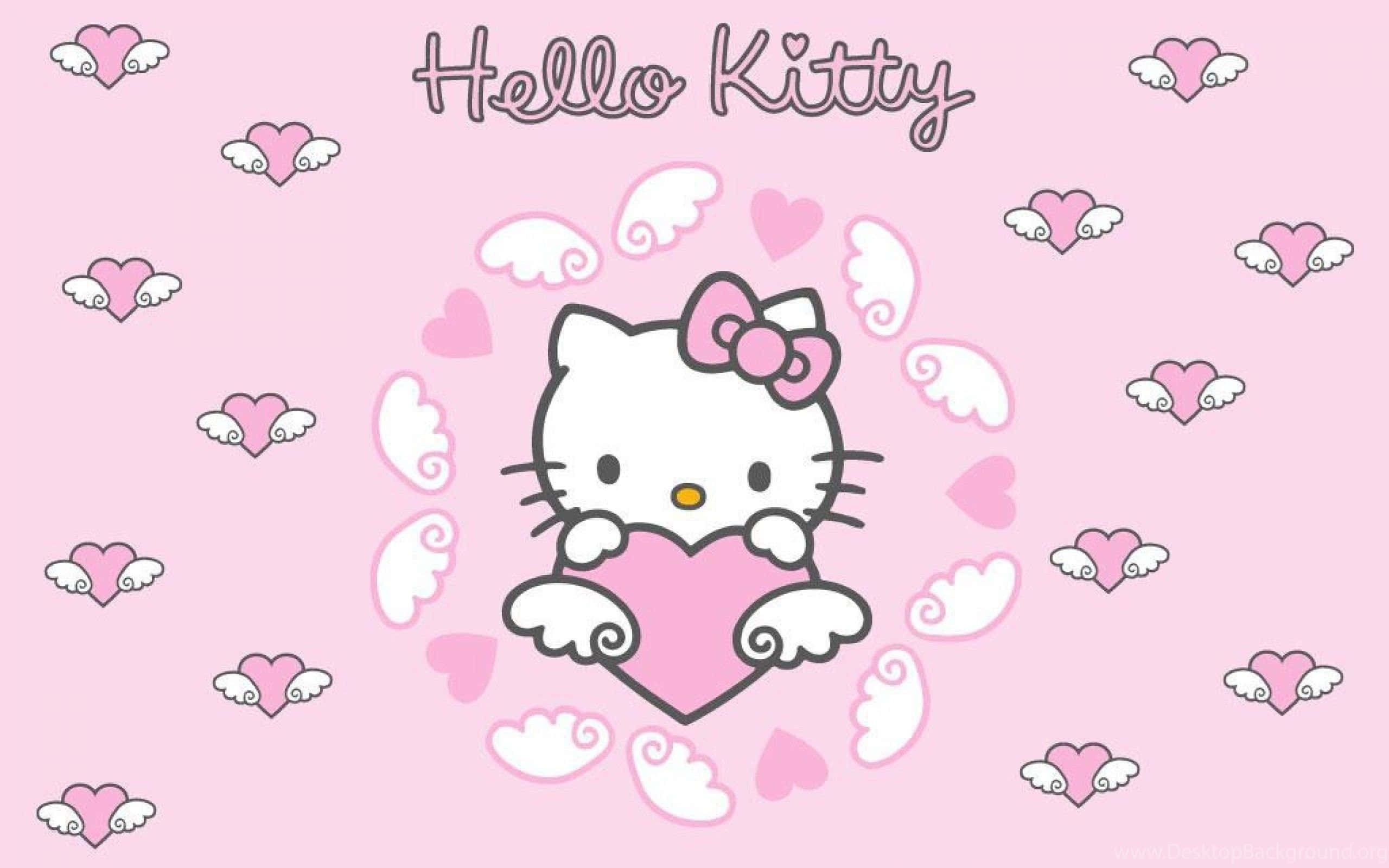 Kitty White 桌布 壁紙 — Hello Kitty 帶有天使翅膀，在柔和的粉紅色背景上，手持一個被漂浮的心形和翅膀包圍的粉紅色心形。