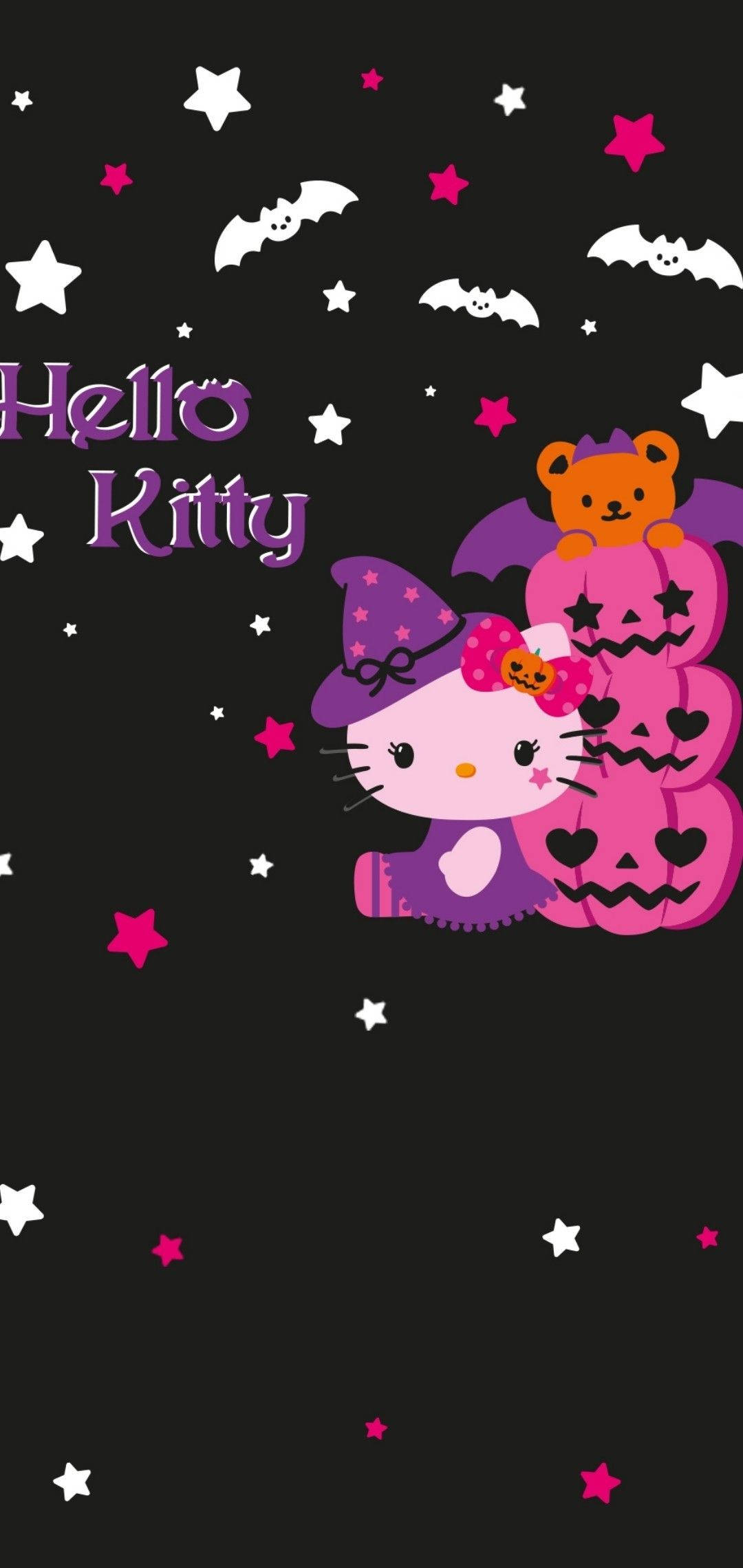 Hello Kitty Halloween 桌布 壁紙 — Hello Kitty 戴著紫色巫婆帽，坐在疊起的粉紅色南瓜燈旁邊，上面有一隻泰迪熊，背景是黑色星空。