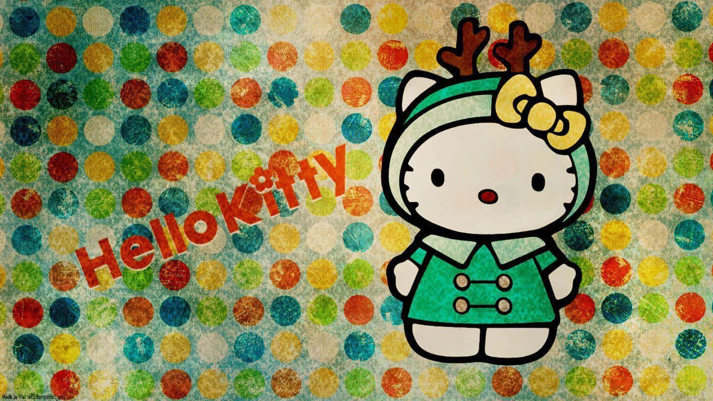 Hello Kitty Christmas 桌布 壁紙 — Hello Kitty 戴著綠色馴鹿帽和黃色蝴蝶結，站在色彩繽紛的波點背景前。